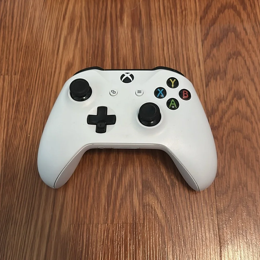 Microsoft xbox one console, controller, and hdmi cable.